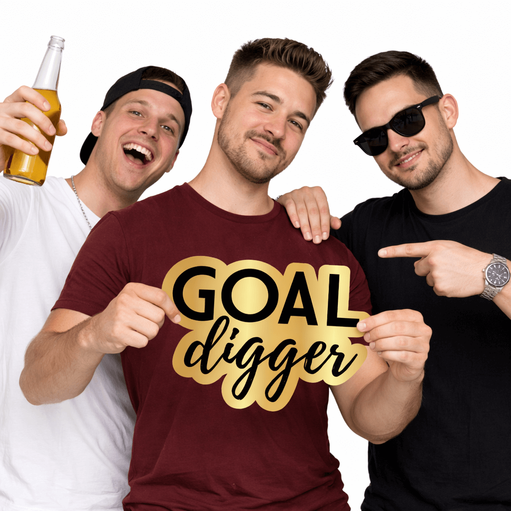 Group of friends holding a Goal Digger Prop, celebrating with fun expressions and drinks.