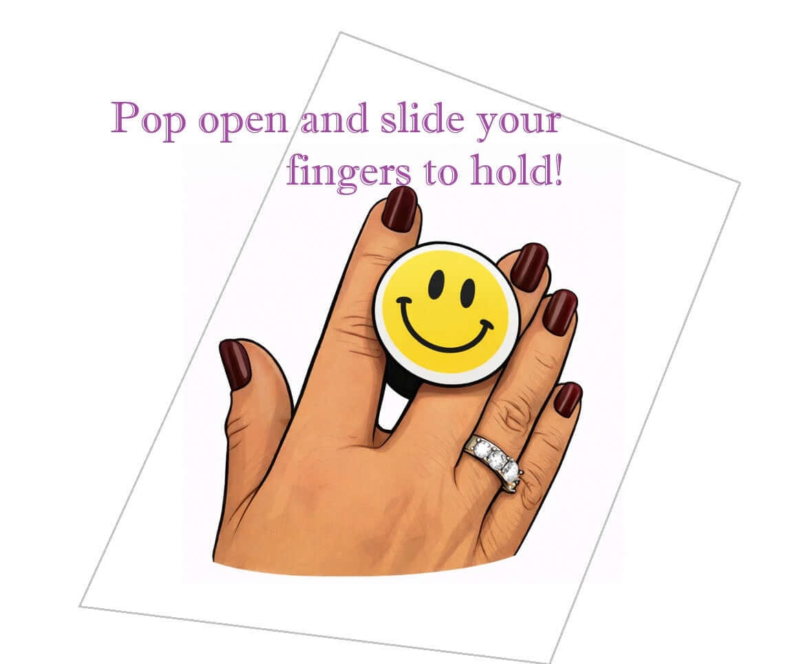 A hand with a smiley face pop socket demonstrating how to hold it, showcasing fun accessory use.