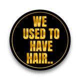 Class Reunion black and gold photo booth prop with the phrase 'We Used to Have Hair' in bold letters.