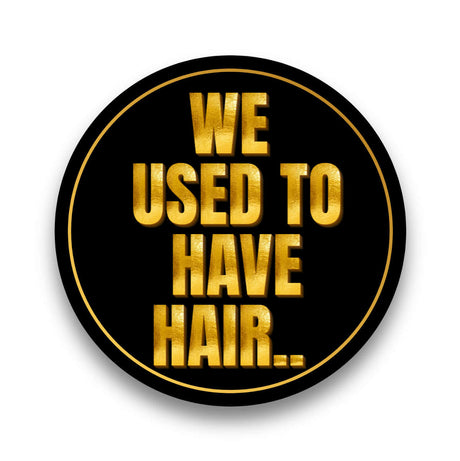 Class Reunion black and gold photo booth prop with the phrase 'We Used to Have Hair' in bold letters.