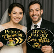 Fairytales/ Princess Party Prop Set featuring bride and groom holding whimsical signs, 'Prince Charming' and 'Living Happily Ever After'.