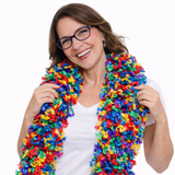 Smiling woman wearing a colorful Featherless Color Explosion Boa, featuring soft polyester material in vibrant hues.