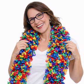 Smiling woman wearing a colorful Featherless Color Explosion Boa, featuring soft polyester material in vibrant hues.