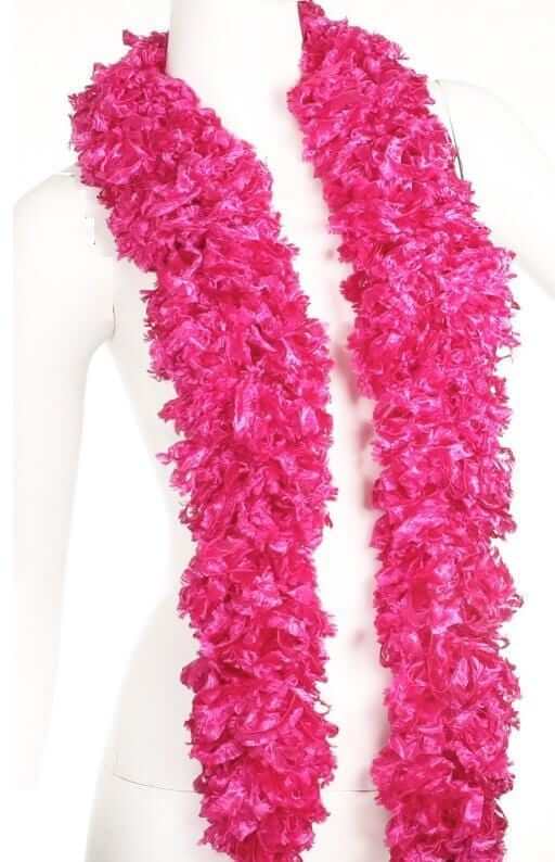 Vibrant featherless pink boa, soft and stylish accessory, perfect for fun occasions, stored in a convenient tule bag.