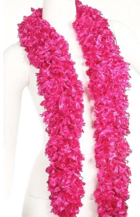 Vibrant featherless pink boa, soft and stylish accessory, perfect for fun occasions, stored in a convenient tule bag.