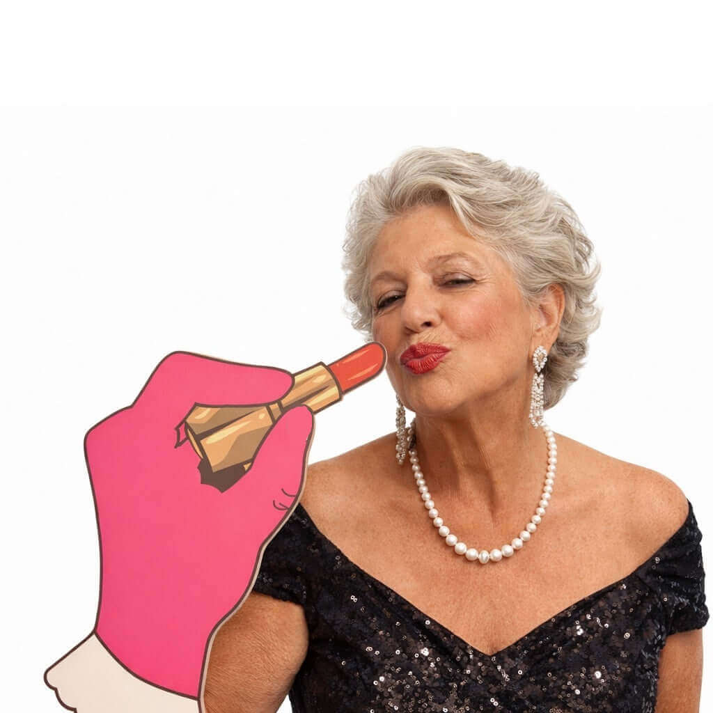 Big Hand Lipstick with PopSocket on back, glamorous woman applying lipstick with fun sign prop.