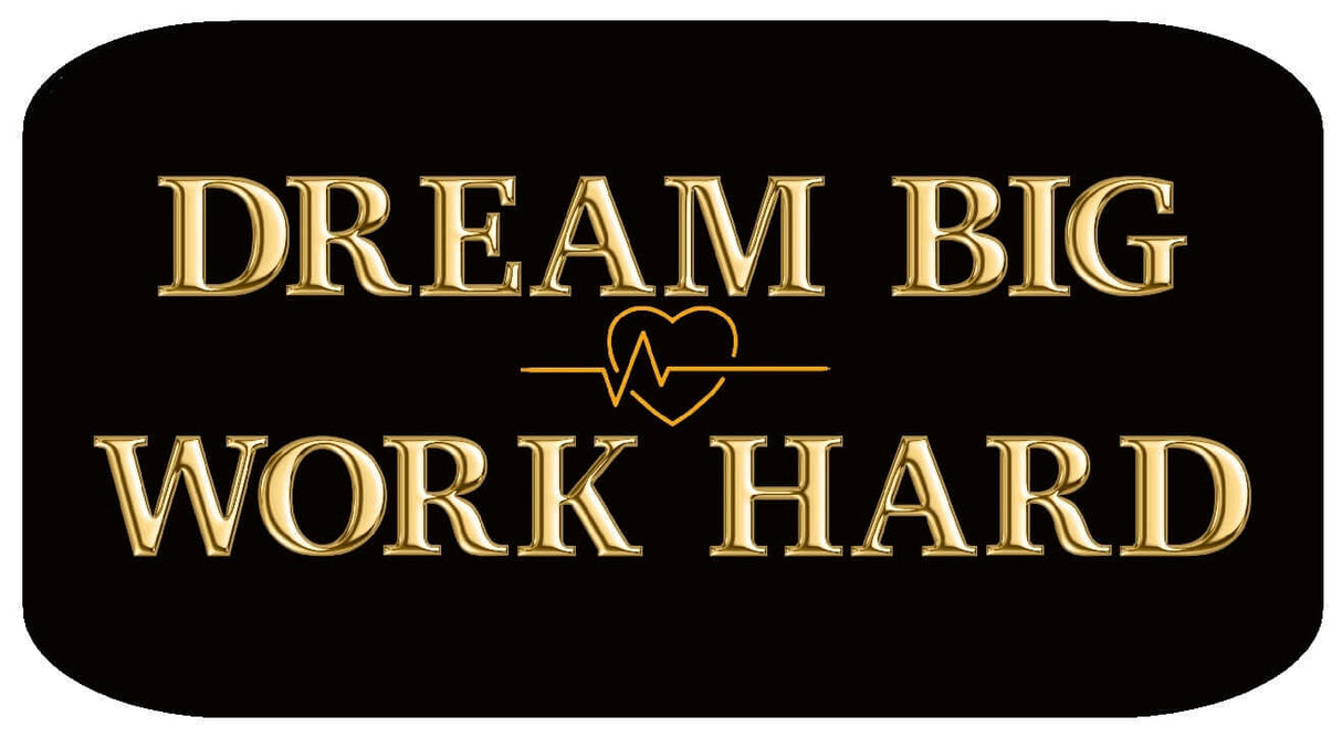 Dream Big Work Hard inspirational sign with golden text on a black background.