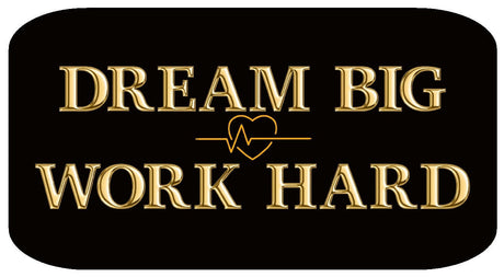 Dream Big Work Hard inspirational sign with golden text on a black background.