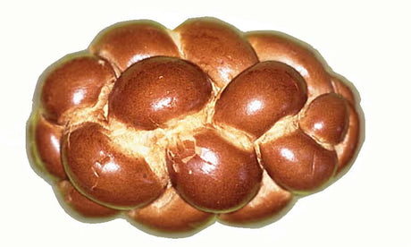 Big challah bread prop for Mitzvah photo booth set, featuring beautiful golden-brown braided design.