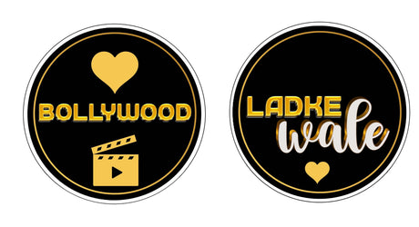 Black and gold Bollywood wedding props featuring text and film icon, perfect for themed celebrations.