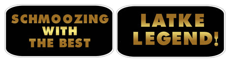 New Mitzvah Set photo booth props featuring "Schmoozing With The Best" and "Latke Legend!" sayings in gold on black.