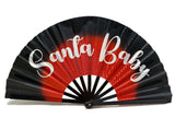 Folding Santa Baby fan, 13 inches tall, colorful prop for festive events, adds fun to any celebration.