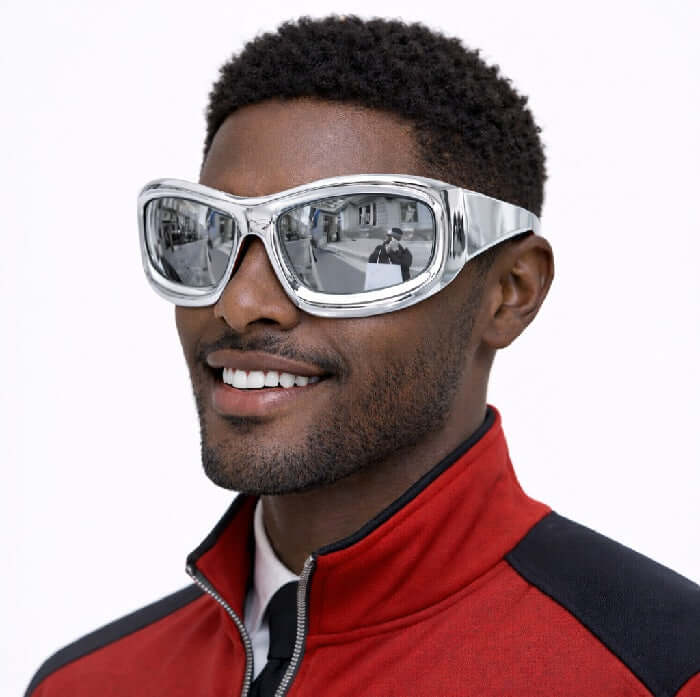 Metallic Silver Disco Glasses worn by a man smiling, reflecting city scenery in the lenses, perfect for parties and events.