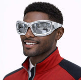 Metallic Silver Disco Glasses worn by a man smiling, reflecting city scenery in the lenses, perfect for parties and events.